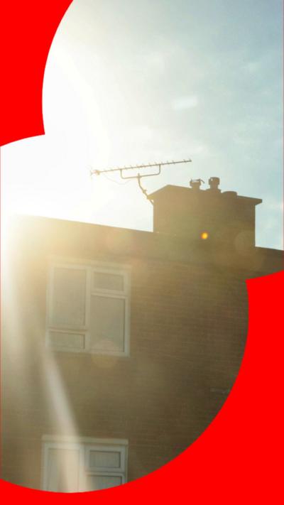 Sun coming over the top of a British house