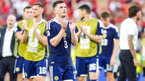 Andy Robertson applauds after Scotland's loss to Morocco
