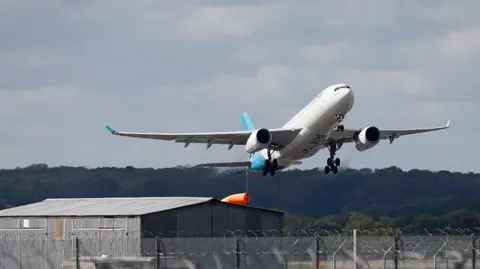 A plane taking flight from Gatwick Airport