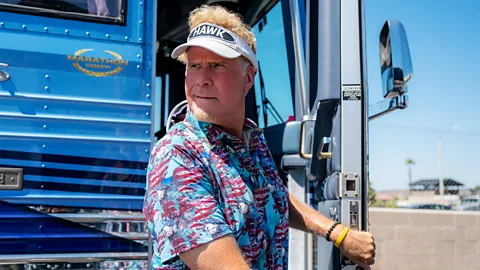 Will Ferrell stood at the front of a bus wearing a golfing gap in Hawk (Credit: Netflix)