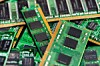 Close-up of green RAM memory modules arranged in a pile