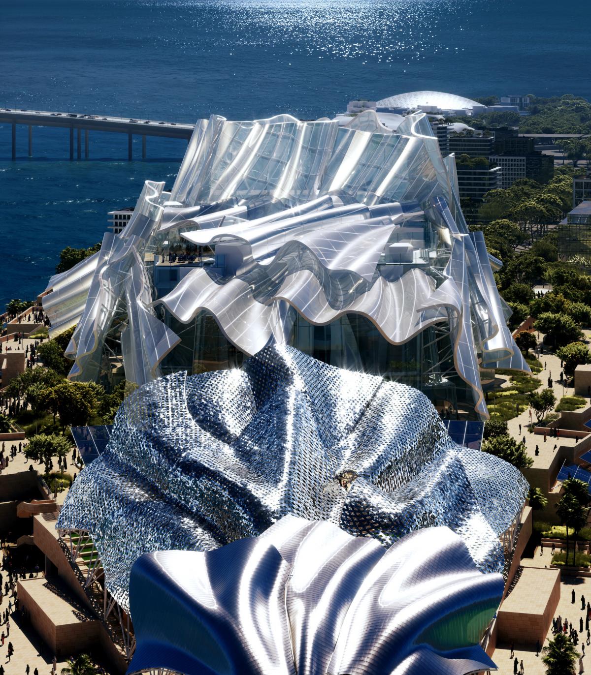 A rendering shows a modern building with rippling reflective skin seen from above in bright sunlight.