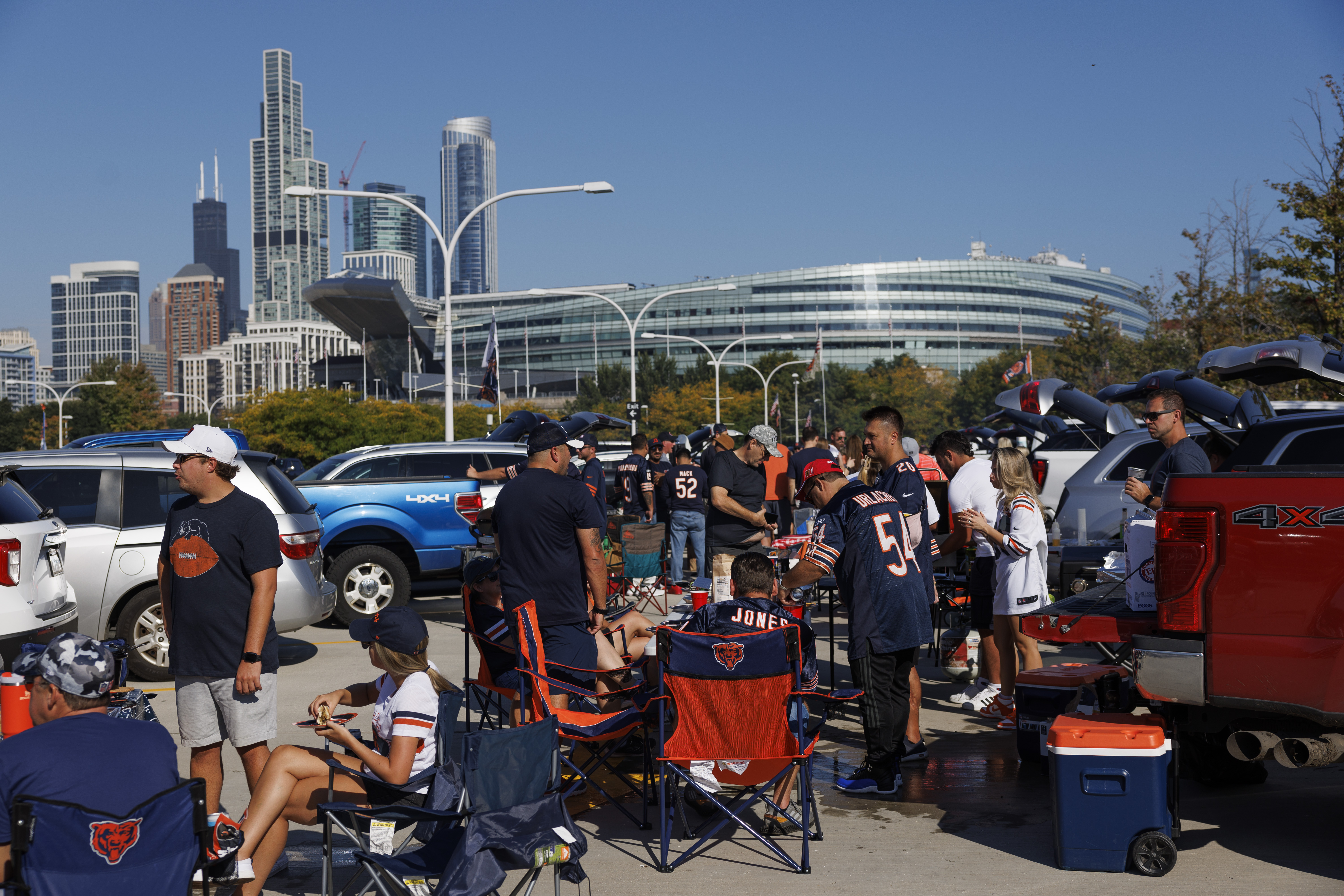 Fans tailgate before the Chicago Bears play the Denver Broncos...