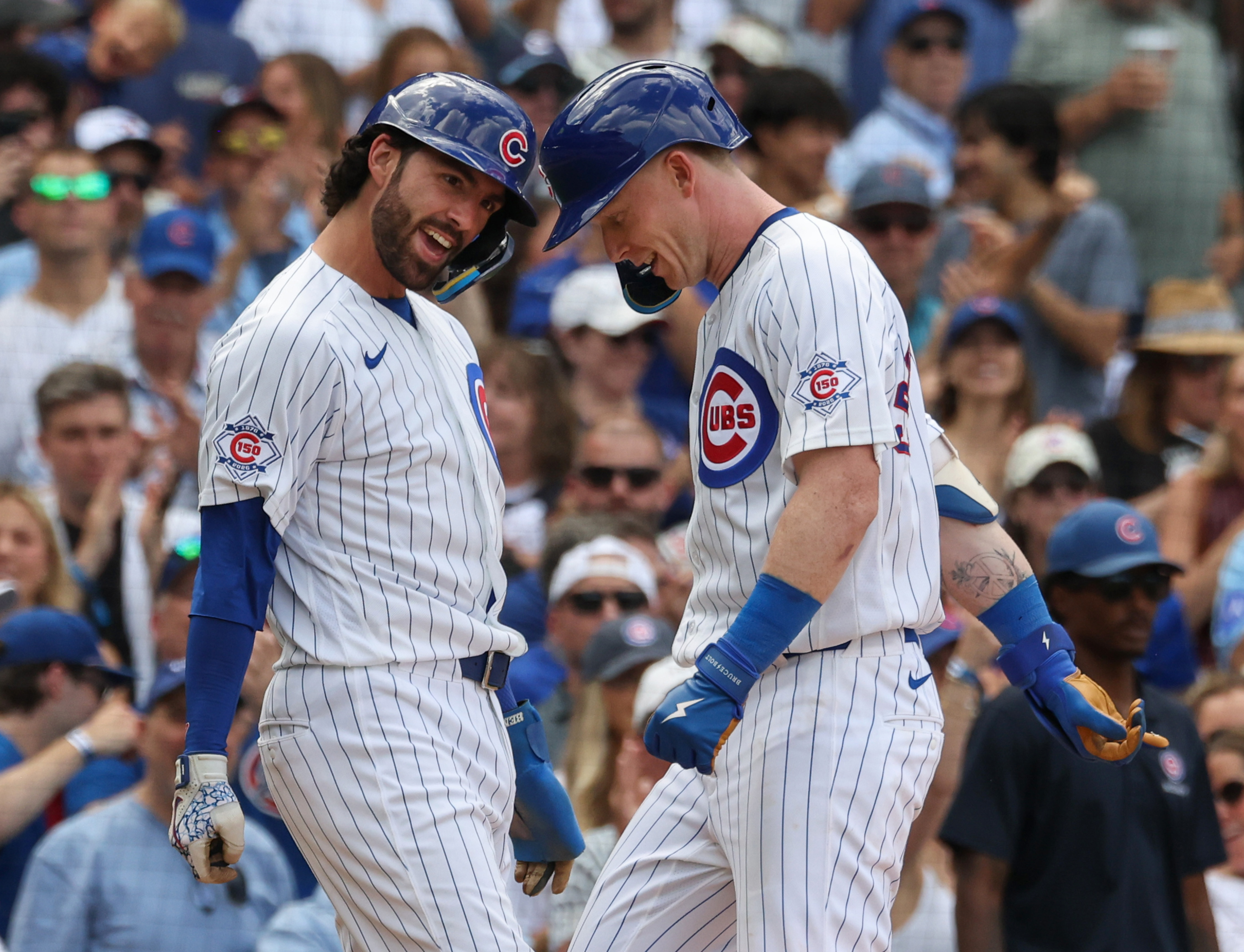 Cubs shortstop Dansby Swanson, left, and center fielder Pete Crow-Armstrong celebrate after Crow-Armstrong hits a two-run home run against the Blue Jays in the sixth inning at Wrigley Field on June 20, 2026, in Chicago. (John J. Kim/Chicago Tribune)