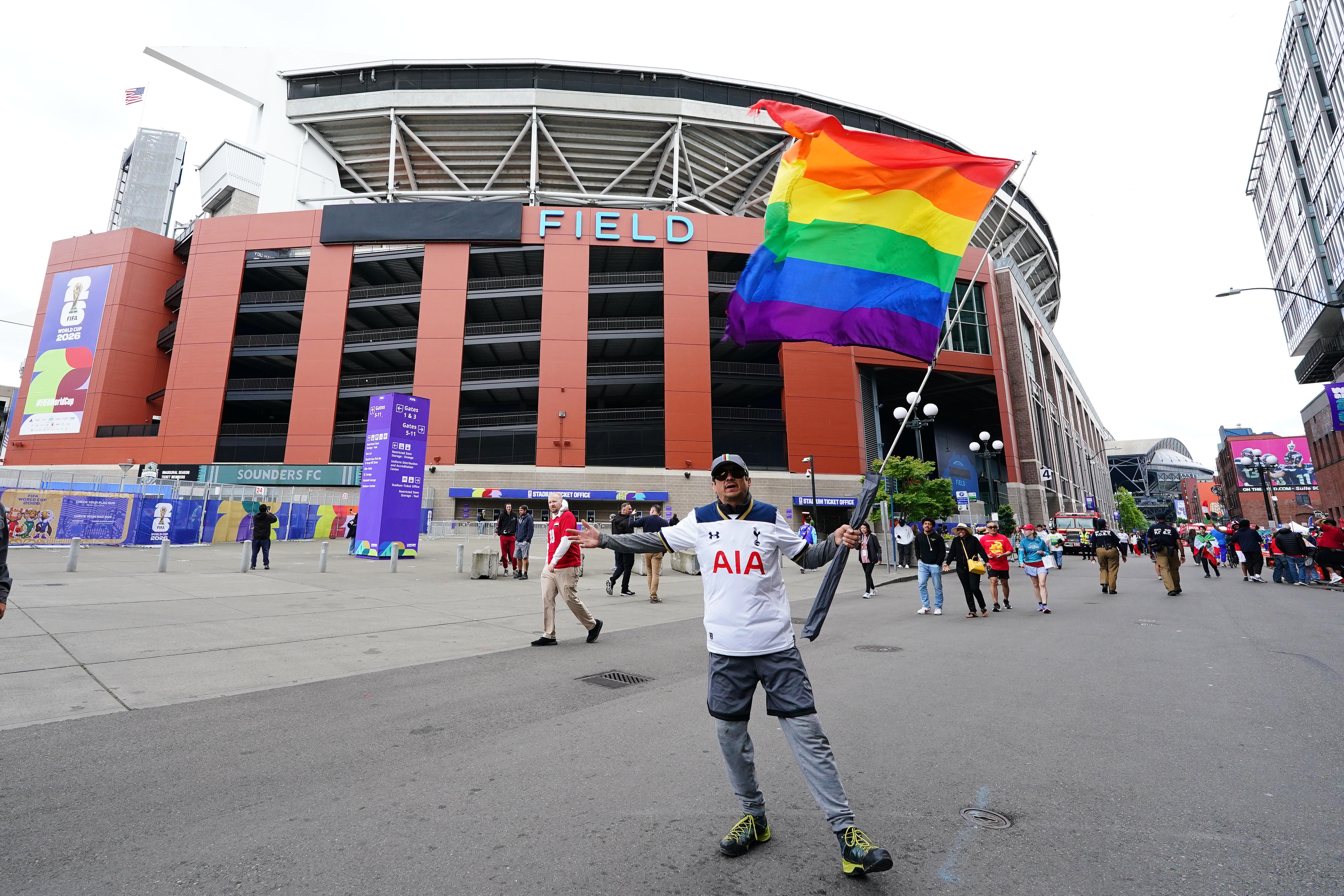 Iran_Egypt_WCup_Soccer__9444 Anthony Vega, of Seattle, displays a Pride flag outside Lumen Field before a World Cup Group G match between Egypt and Iran on Friday, June 26, 2026, in Seattle. (Ted S. Warren/AP)