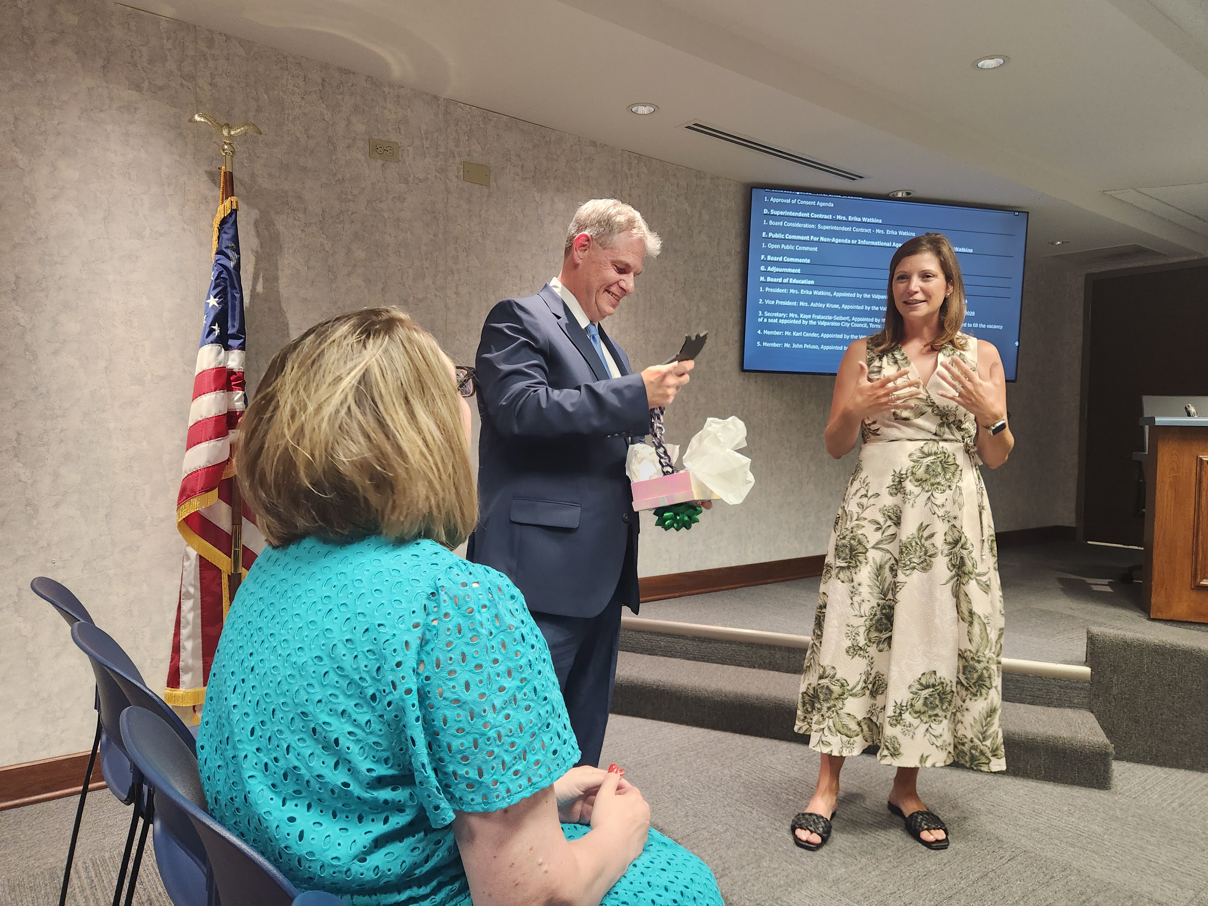 New Valparaiso Community Schools Superintendent Brian Smith is presented with school spirit lanyards for himself and his wife, Sallie, by board member Ashley Kruse after being unanimously approved for hire at a special school board meeting Tuesday, June 30, 2026. (Shelley Jones/for the Post-Tribune)