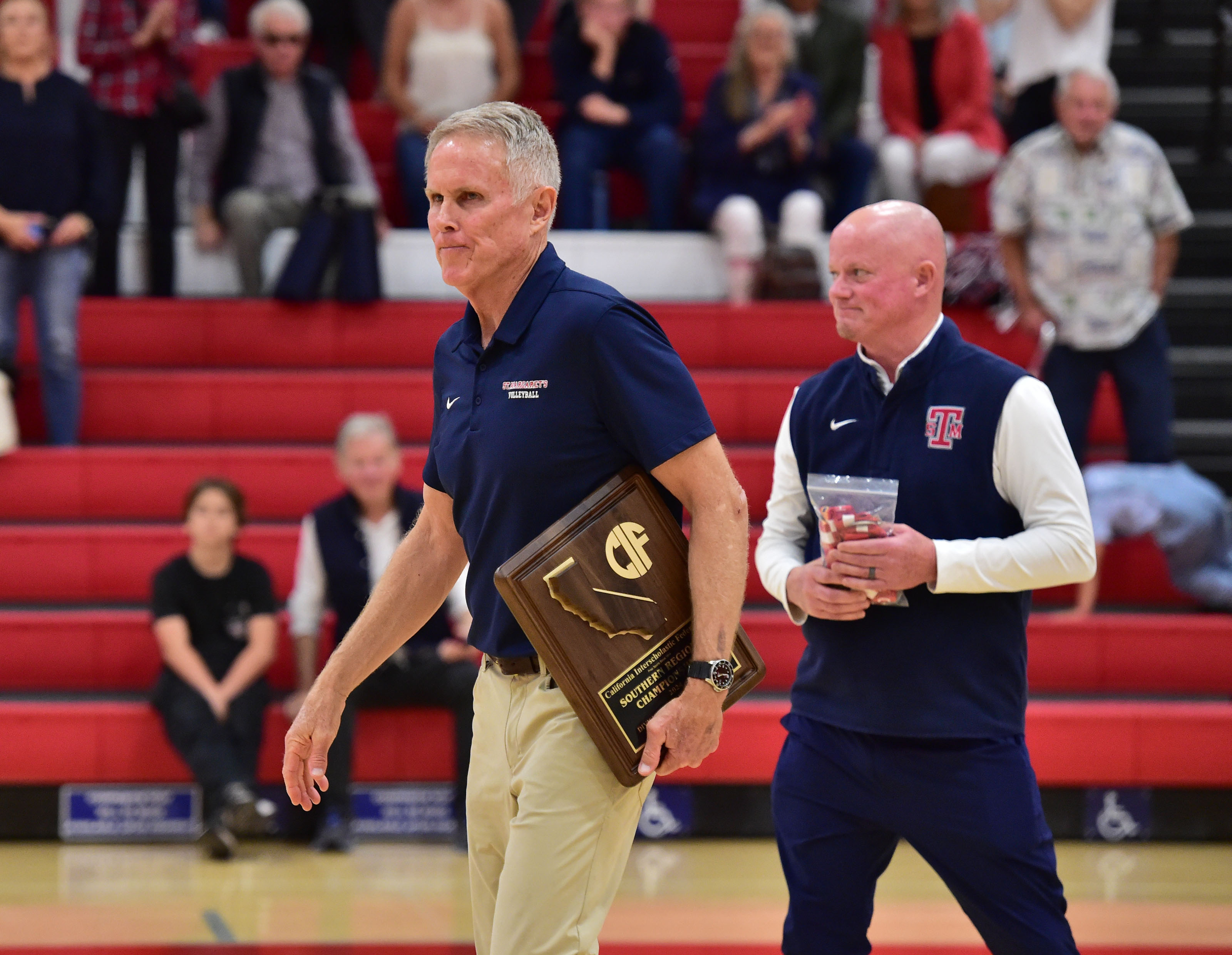 St. Margaret’s coach Bob Yoder walks off court with runner up plaque after loss to Redondo in CIFSS Regional boys volleyball final Saturday May 18, 2024 (Photo by Robert Casillas, Contributing Photographer)
