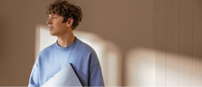 A man holding a folder.