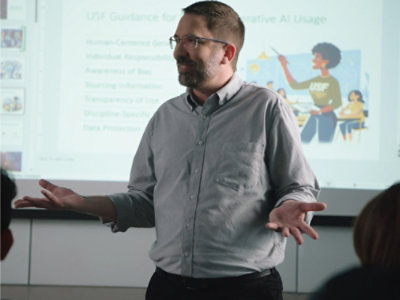 A person in a grey shirt.