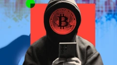 ፊቱ በቢትኮይን አርማ የተሸፈነ ሀከር