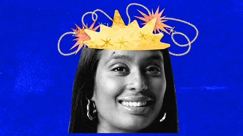 Serenity Strull A collage shows a woman with hooped earrings and long dark hair with a yellow shape drawn on her forehead with curving lines of yellow and orange zaps around it, against a dark blue background (Credit: Serenity Strull)