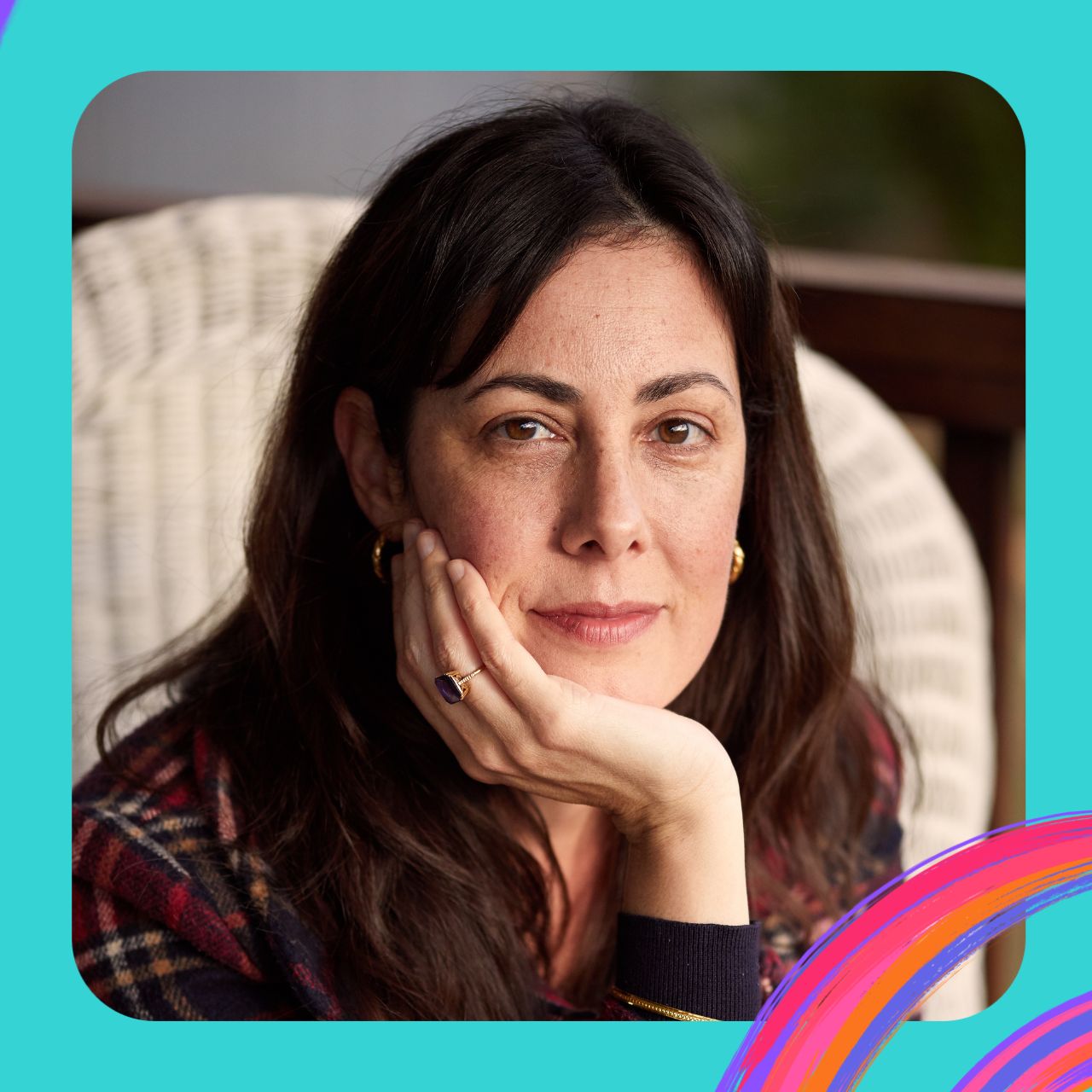 Sita is pictured holding her chin in her hand, with a sparkly ring on her finger.