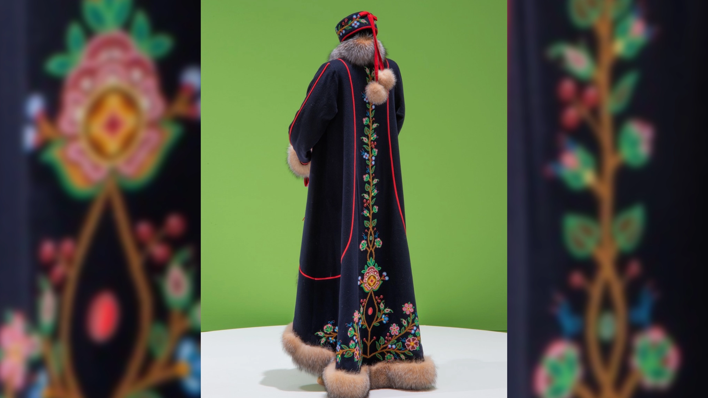 a beaded long balck coat with fur trim by Jennine Krauchi, and Photo by Don Hall.