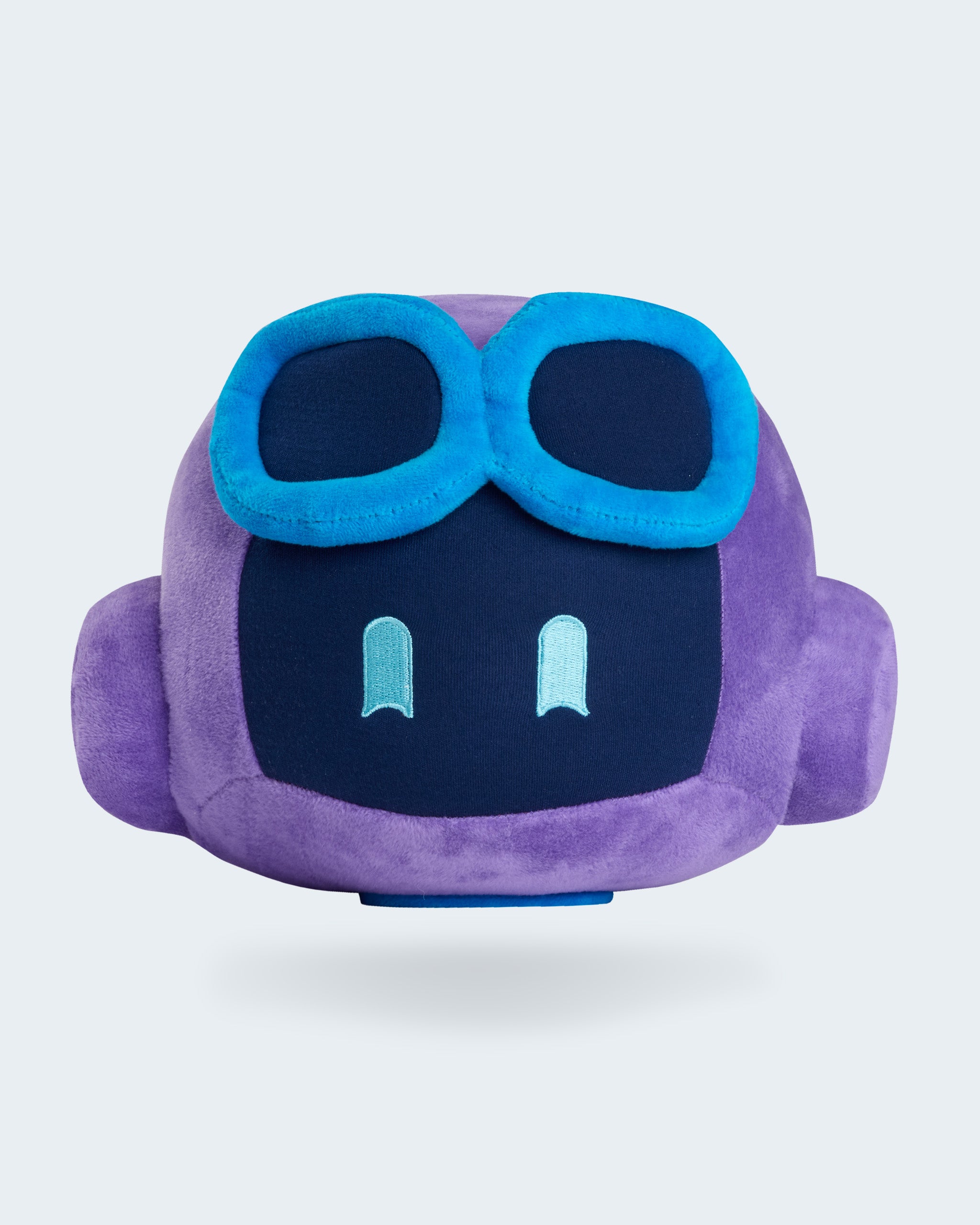 Purple GitHub Copilot plush toy with a soft rounded shape, embroidered face, and blue goggles