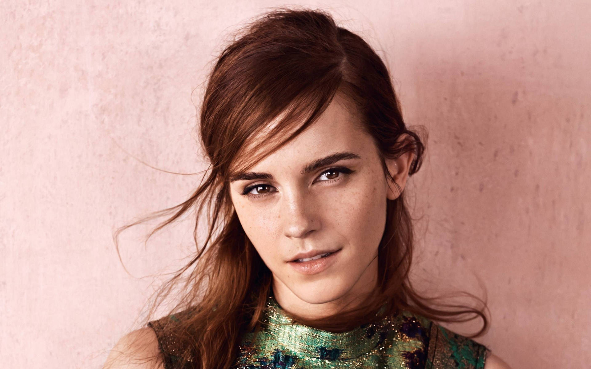 Emma Watson strikes a confident pose. Wallpaper