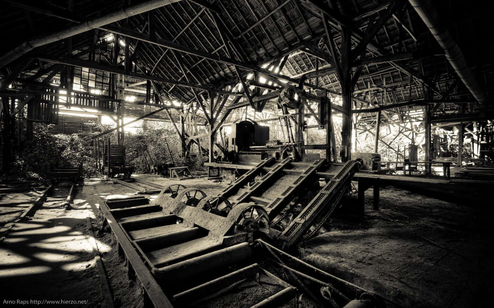 A Black And White Image Of An Old Factory