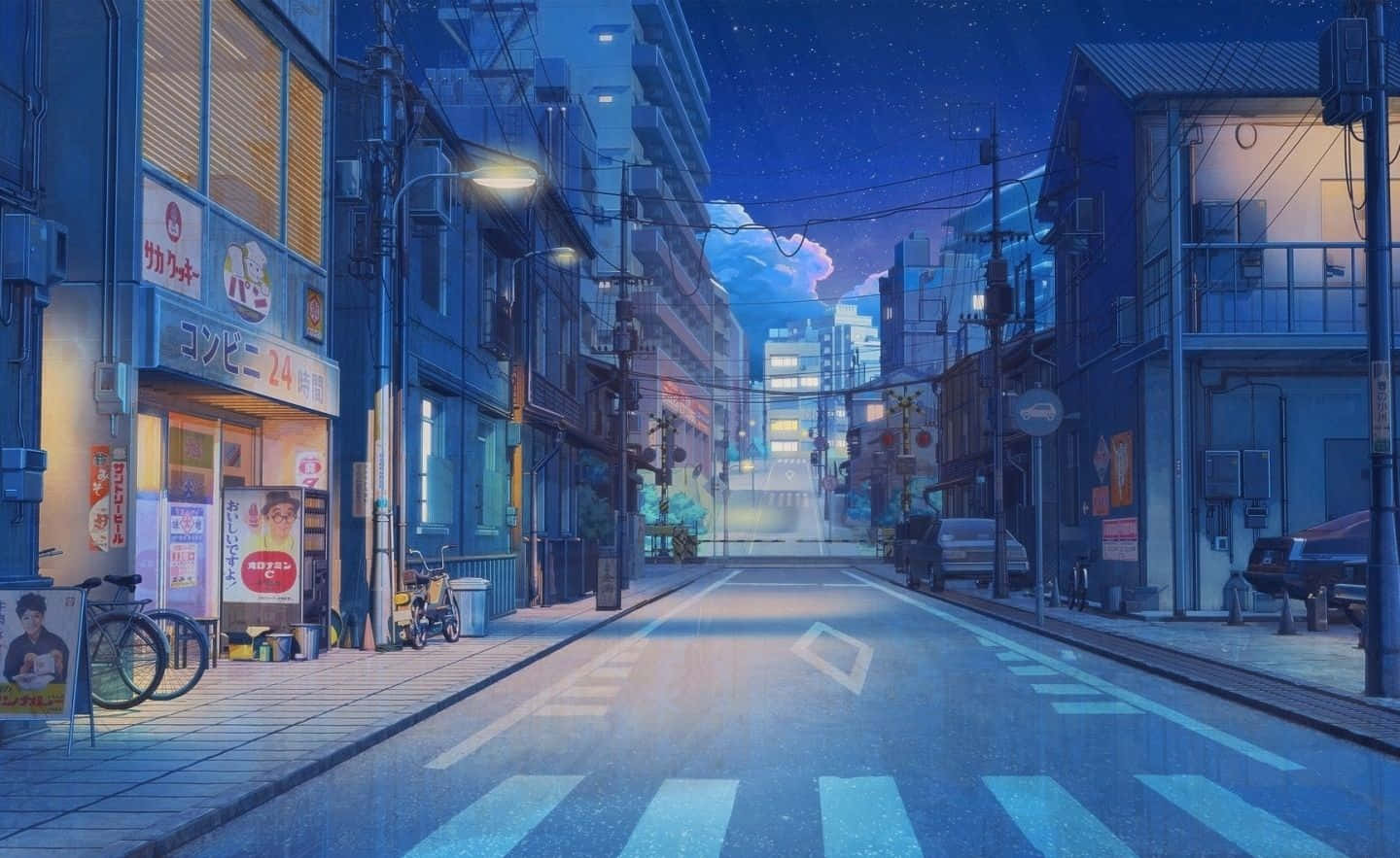 A Street Scene With Buildings And Cars At Night